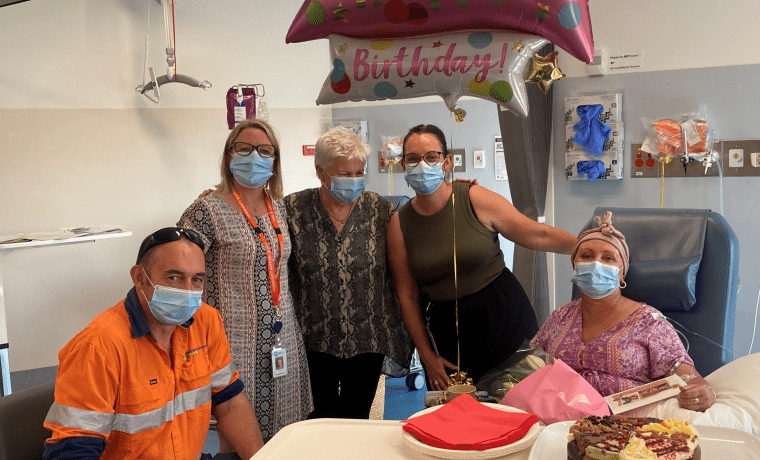 Cheryl Wilson, right, celebrates her birthday while receiving chemotherapy with, from left, husband Steve Fisher, Bass Coast Health Volunteer and Fundraising Manager Vicki Riley, CEO Jan Child and Operations Director Jess Jude.