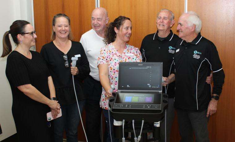 Bass Coast Health’s Jess Jude, Anna Kenny and Erin Passarin show the amazing new ultrasound bought with a donation from the Inverloch Fundraising Auxiliary to Auxiliary members Klaus Edel, Terry Hall and President Gerry Surridge.