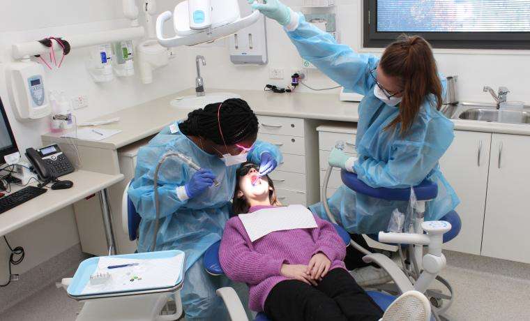 Patient Gemma Ayton receives care from BCH Oral Health Therapist Marlene Willis and Dental Assistant Emily Trewin at Wonthaggi Hospital.