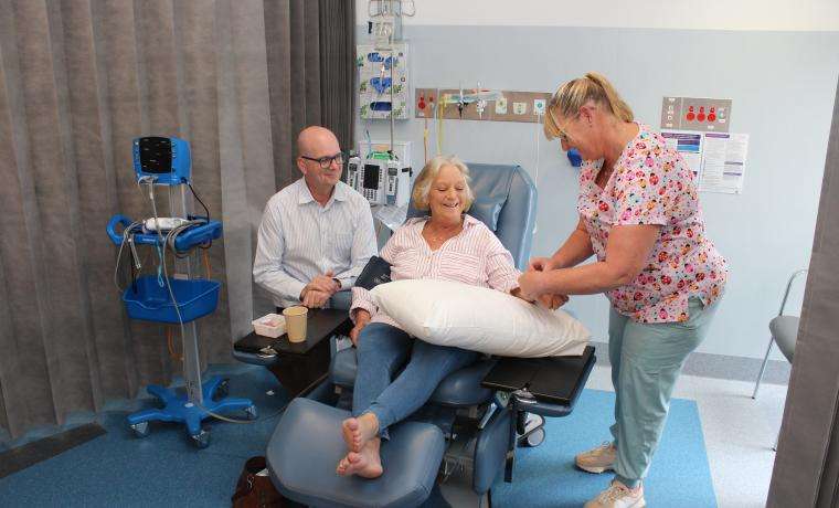 Cancer patient Cheryl Lindsay prepares to receive treatment at L. Rigby Centre at Wonthaggi Hospital. She’s with her Medical Oncologist Professor Mark Shackleton and Registered Nurse Linda Tack.